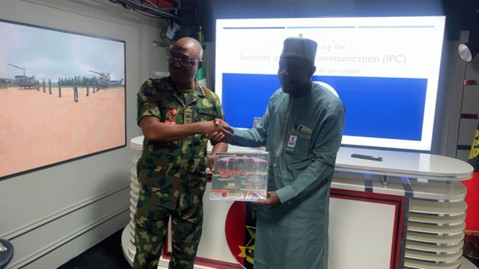 Department of Army Public Relations (DAPR), Major General Onyema Nwachukwu  Presenting a Gift to the Founder and Executive Director, Institute of Public Communication (IPC), Dr. Suleiman A. Suleiman